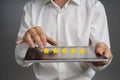 Five star rating or ranking, benchmarking concept. Man with tablet PC assesses service, hotel, restaurant Royalty Free Stock Photo