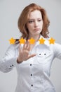 Five star rating or ranking, benchmarking concept. Woman assesses service, hotel, restaurant Royalty Free Stock Photo