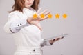 Five star rating or ranking, benchmarking concept. Woman assesses service, hotel, restaurant Royalty Free Stock Photo