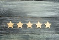 Five stars on a dark background. The concept of rating and evaluation. The rating of the hotel, restaurant, mobile application. Qu Royalty Free Stock Photo