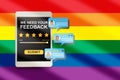 LGBT business rating application review with comment on computer tablet screen on rainbow abstract background Royalty Free Stock Photo