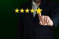 Five stars testimonial. Customer review good rating concept hand pressing five star on screen Royalty Free Stock Photo