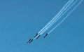 Five stunt planes flying in formation