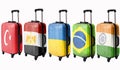 Five suitcases with flags depicted on these countries: Egypt, Ukraine, Brazil, Turkey, India. Isolate Royalty Free Stock Photo