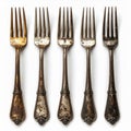 Five Tarnished Silver Forks on White Background Royalty Free Stock Photo
