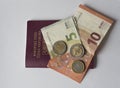 Five and ten euros bank bill and two and one euro coin on EU pas Royalty Free Stock Photo