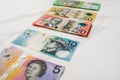 Five ten twenty fifty hundred Australian dollar banknotes on the white background Royalty Free Stock Photo