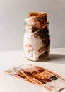 Five thousandth notes are packed in a glass jar. Russian banknotes with inscription `five thousand rubles` of 5000 rubles. Backgro Royalty Free Stock Photo