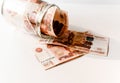 Five thousandth notes are packed in a glass jar. Russian banknotes with inscription `five thousand rubles` of 5000 rubles. Backgro Royalty Free Stock Photo