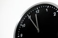 Five To Midnight setting on the black wall clock Royalty Free Stock Photo