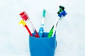 Five tooth brushes in ceramic glass Royalty Free Stock Photo