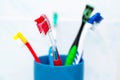 Five tooth brushes in ceramic glass Royalty Free Stock Photo