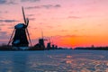 Traditional windmills on ice Kinderdijk, Netherlands at dawn Royalty Free Stock Photo