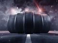 Five tyres rolling on a street