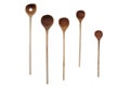 Five used wooden spoons