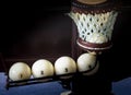 Five white billiards balls scored in the hole, the light in the hole, the background close-up Royalty Free Stock Photo