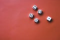Five white dice on an orange background. Combination: two pairs of sixes and fives