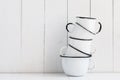 Five white enameled mugs Royalty Free Stock Photo