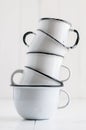 Five white enameled mugs Royalty Free Stock Photo