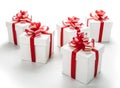 White festive gift boxes with red bows on a white Royalty Free Stock Photo