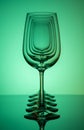 Five wine glasses silhouette in row concentric on green background Royalty Free Stock Photo