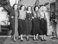 Five women posing in a back yard Royalty Free Stock Photo