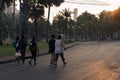 Five women talking, walking together at the park