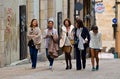 Five women walking on the street