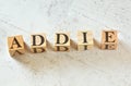 Five wooden cubes with letters ADDIE means Analysis Design Development Implementation Evaluation on white stone like board, view Royalty Free Stock Photo