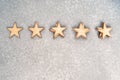 Five wooden stars in piles