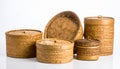 Collection of five woven bamboo baskets with lids on a white background container Royalty Free Stock Photo