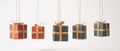 Five Wrapped Gifts Hanging by String on a White Background Royalty Free Stock Photo