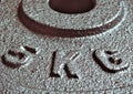 Five & x28;5& x29; kg weight disk plate close up. Metallic texture gray dark background