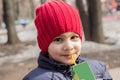 The child drinks juice in the Playground. emotional close-up portrait.