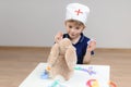 Children`s game in the hospital, the doctor is taking the patient Royalty Free Stock Photo