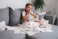 Five year old girl scattered napkins around the sofa. Cunning daughter made a mess at home