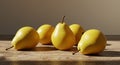 Five Yellow Pears on Wooden Table in Warm Light Royalty Free Stock Photo