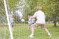 Five young friends playing soccer