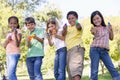Five young friends with water guns outdoors Royalty Free Stock Photo