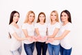 Five young international breast cancer fighters in white tshirts with pink breast cancer awareness ribbons in hands, isolated on