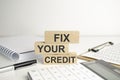 Fix Your Credit text is written on building blocks and light background