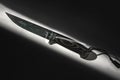 Fixed blade tactical knife with sheath on white background in hard light Royalty Free Stock Photo