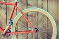 Fixed gear bicycle parked with wood wall, close up image