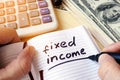 Fixed income written in a note. Royalty Free Stock Photo