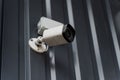 Fixed security camera attached to profiled steel siding with rigid mounting arm Royalty Free Stock Photo
