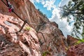 Fixed Steel Wire and Steps Going Up a Via Ferrata Climbing Path on a Steep Stone Cliff Wall Royalty Free Stock Photo