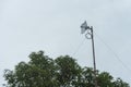 A fixed wireless internet antenna mounted on the roof of a house. Wireless broadband service at a rural area. Overcast weather