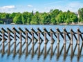 Fixed wooden logs forming a ice barrier near Charles Bridge on Vltava rive, Prague