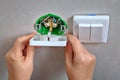 Fixing electrical wall outlet and light switch, electrician han