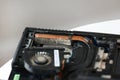 Fixing laptop. Repairman holds cooling fan and repairs from overheating. Disassembling computer, replacement, clean dust